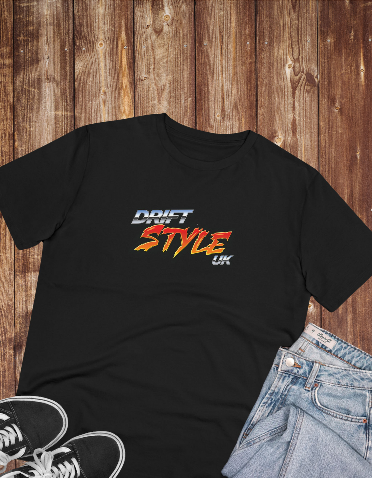 black tshirt with 'drift style uk' text on the front next to a pair of shoes