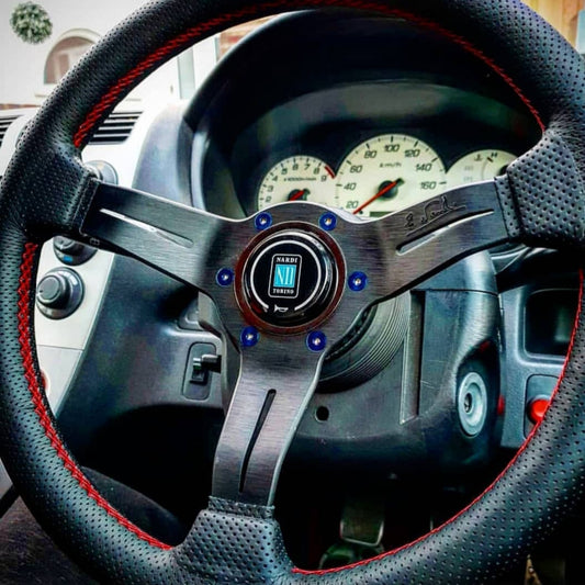 a Nardi steering wheel showcasing titanium steering wheel bolts