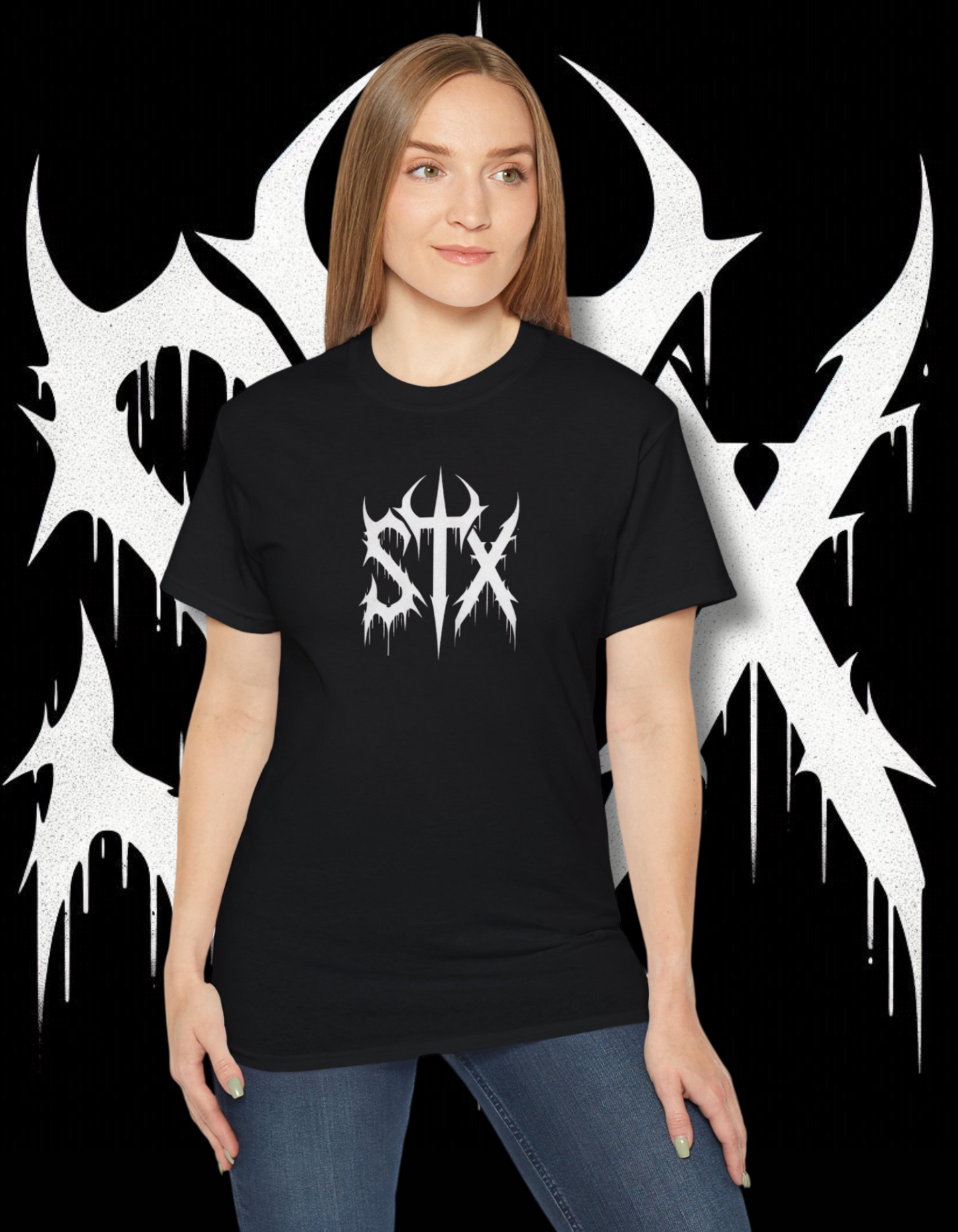 A person wearing a black 'STXSTX' t-shirt with a bold white graphic design resembling a heavy metal style with a slash.
