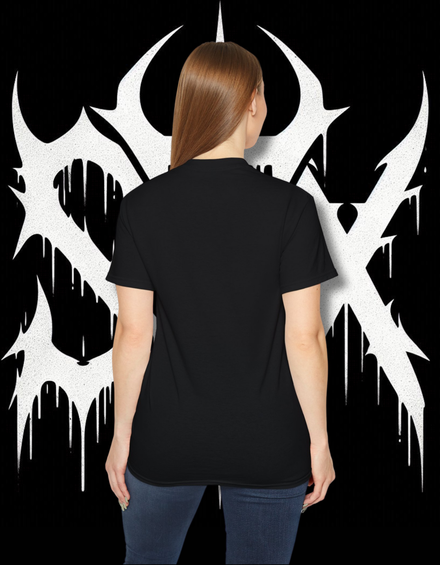 A person wearing a black 'STXSTX' t-shirt with a bold white graphic design resembling a heavy metal style with a slash.