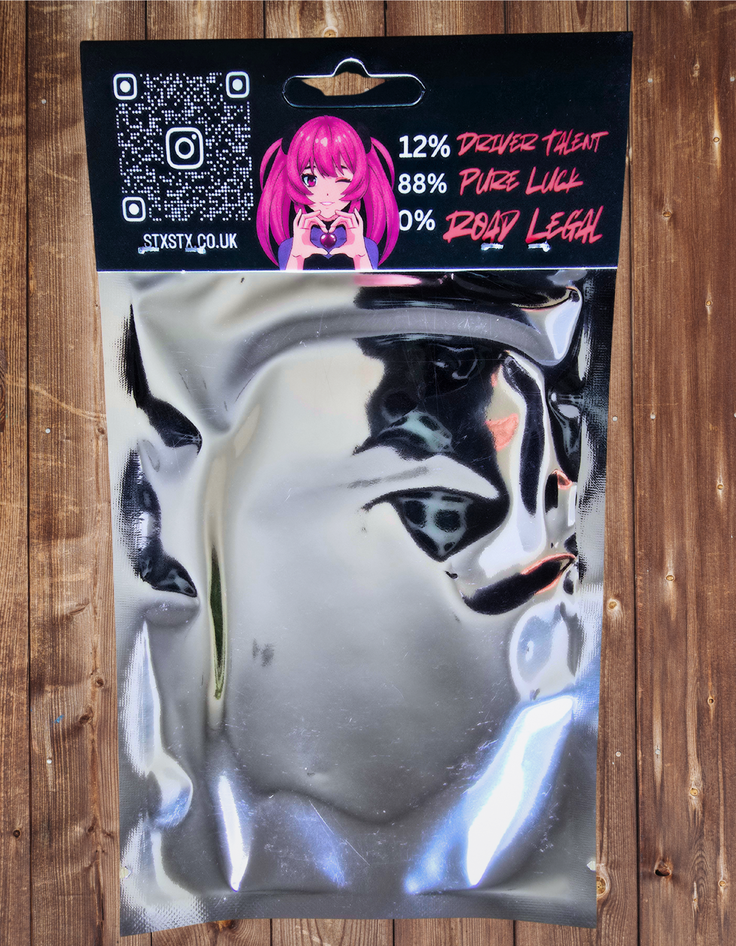 An air freshener with the logo 'STXSTX' in JDM style packaging