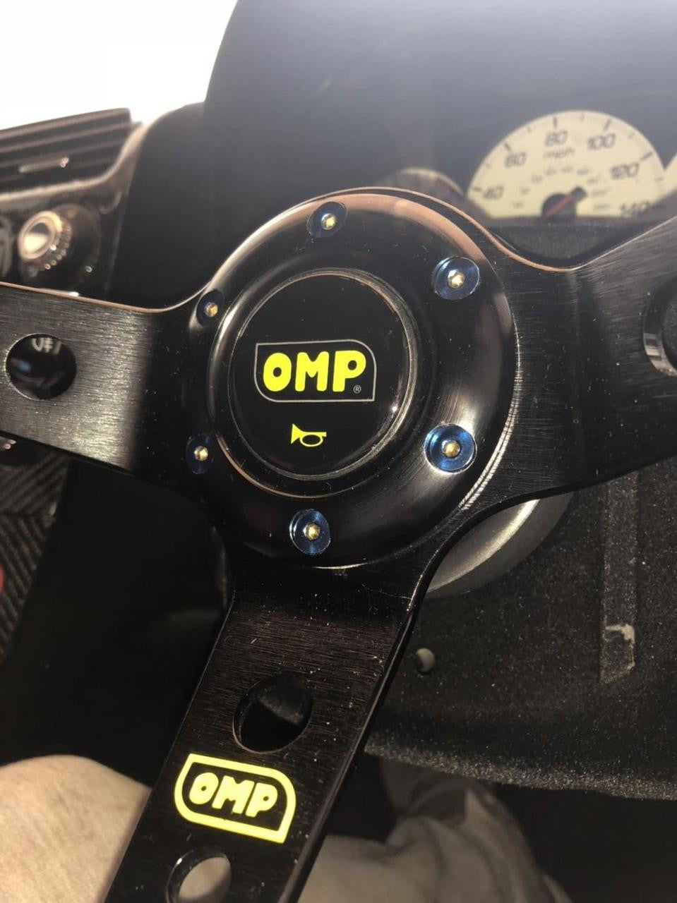 OMP steering wheel showcasing titanium steering wheel bolts