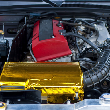 A gold heat reflective sheet with a self-adhesive backing, fitted to a jdm car