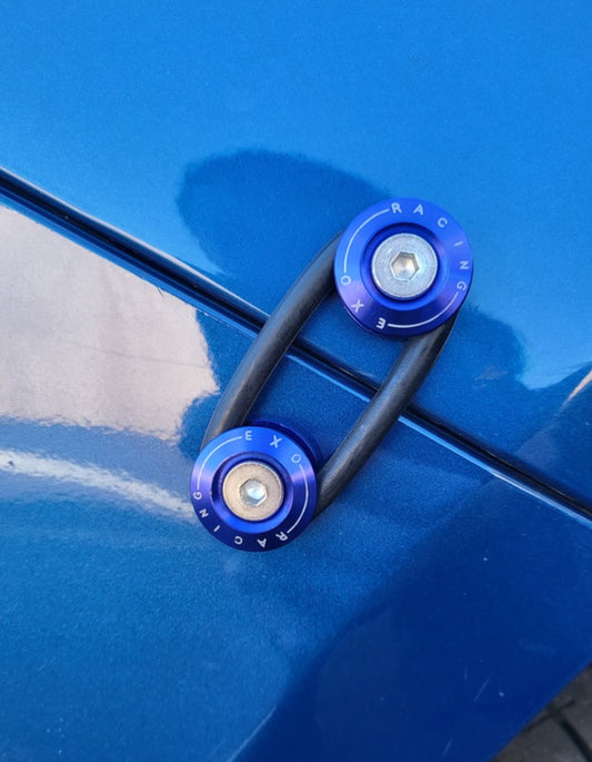 Set of blue metal Bumper ties and black rubber rings on a blue blue toyota chaser