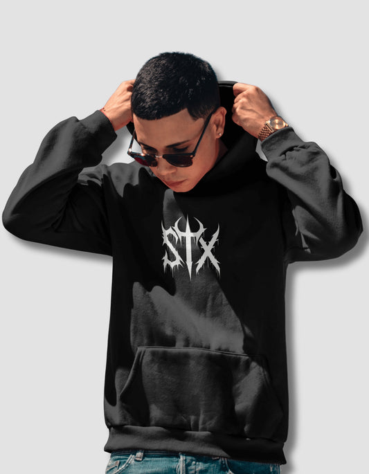 Person wearing a black hoodie with a logo on a light gray background