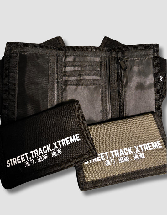 Two wallets, one black and one green, with 'Street Track Xtreme' branding on a light gray background.