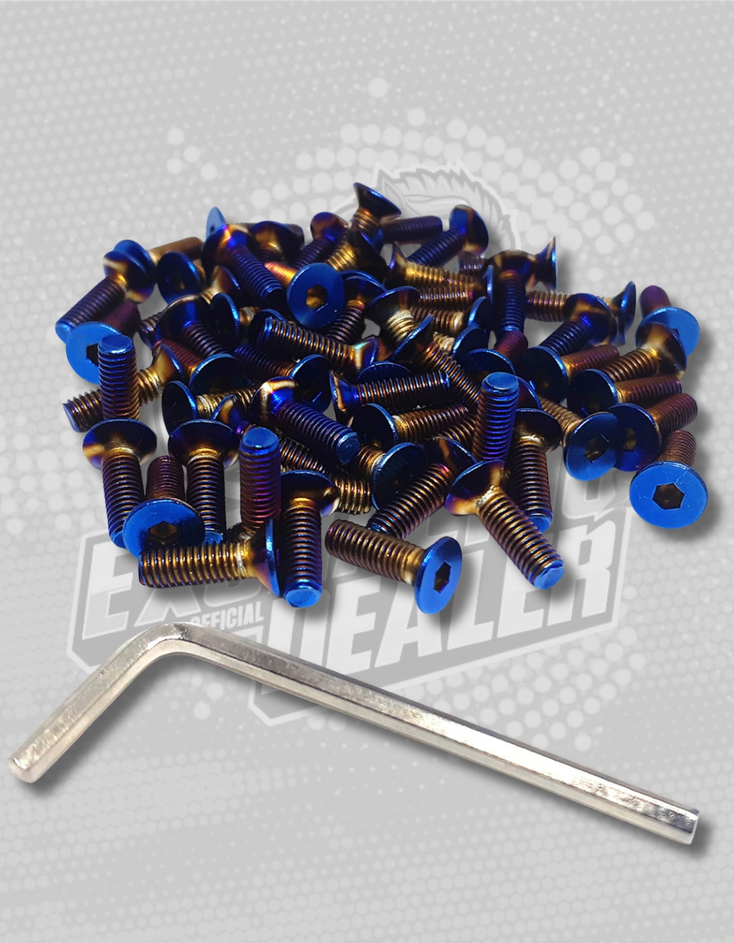 collection of titanium steering wheel bolts in a pile and next to it is a tool
