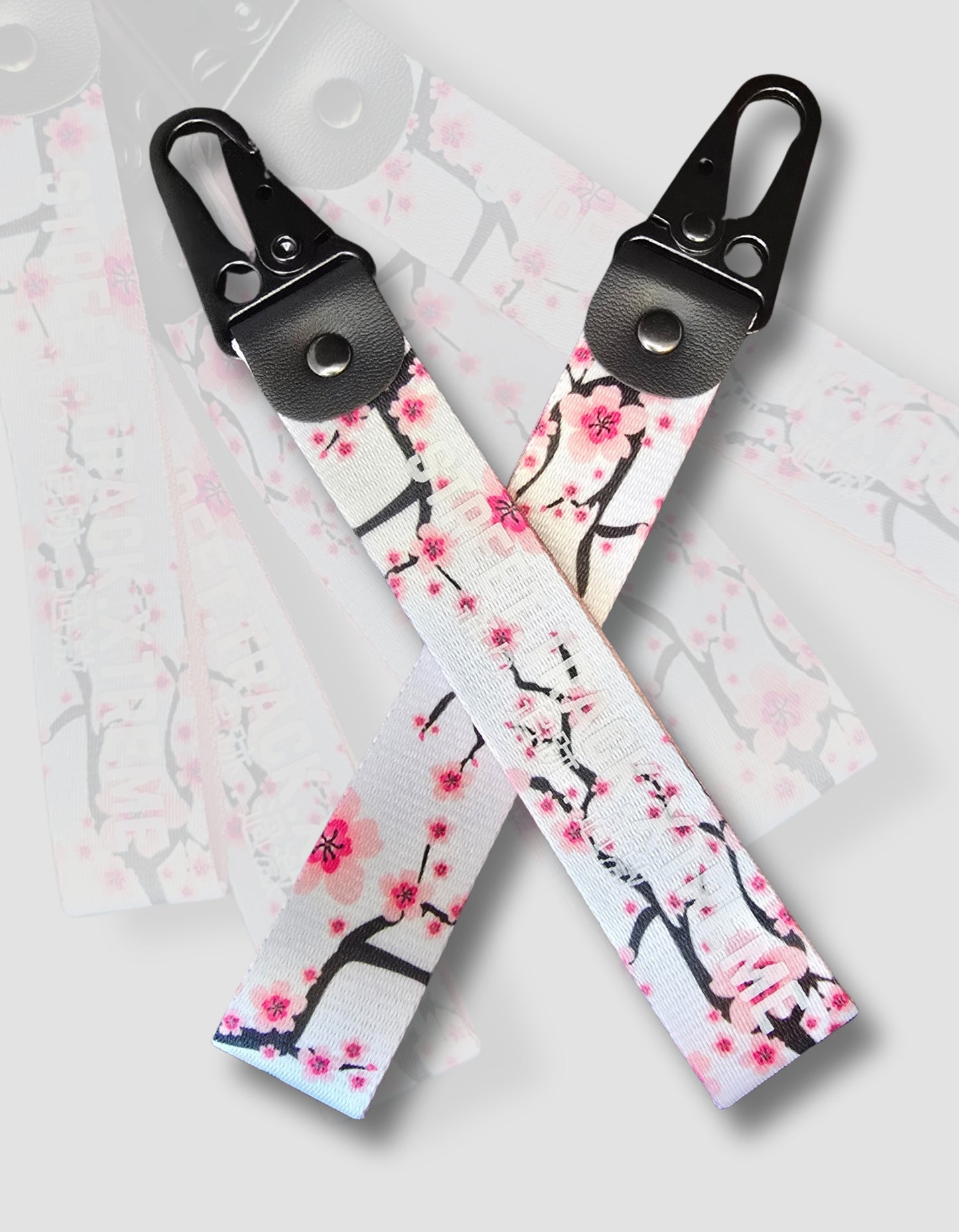 Cherry Blossom key-ring clip, JDM (Japanese domestic market) style with the words street track extreme printed on it. Japanese automotive style