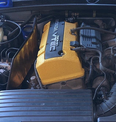 A gold heat reflective sheet with a self-adhesive backing, fitted to a jdm car