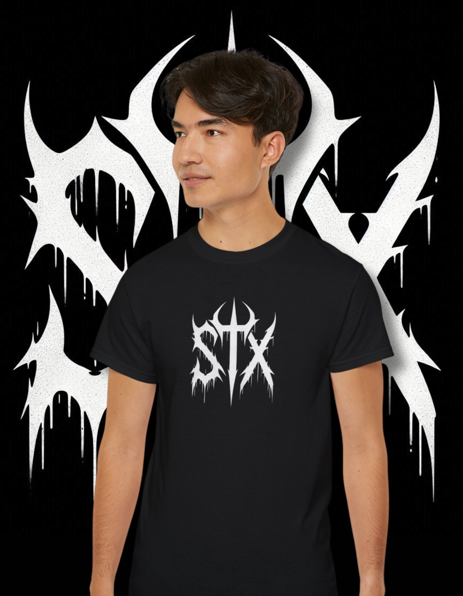 A person wearing a black 'STXSTX' t-shirt with a bold white graphic design resembling a heavy metal style with a slash.
