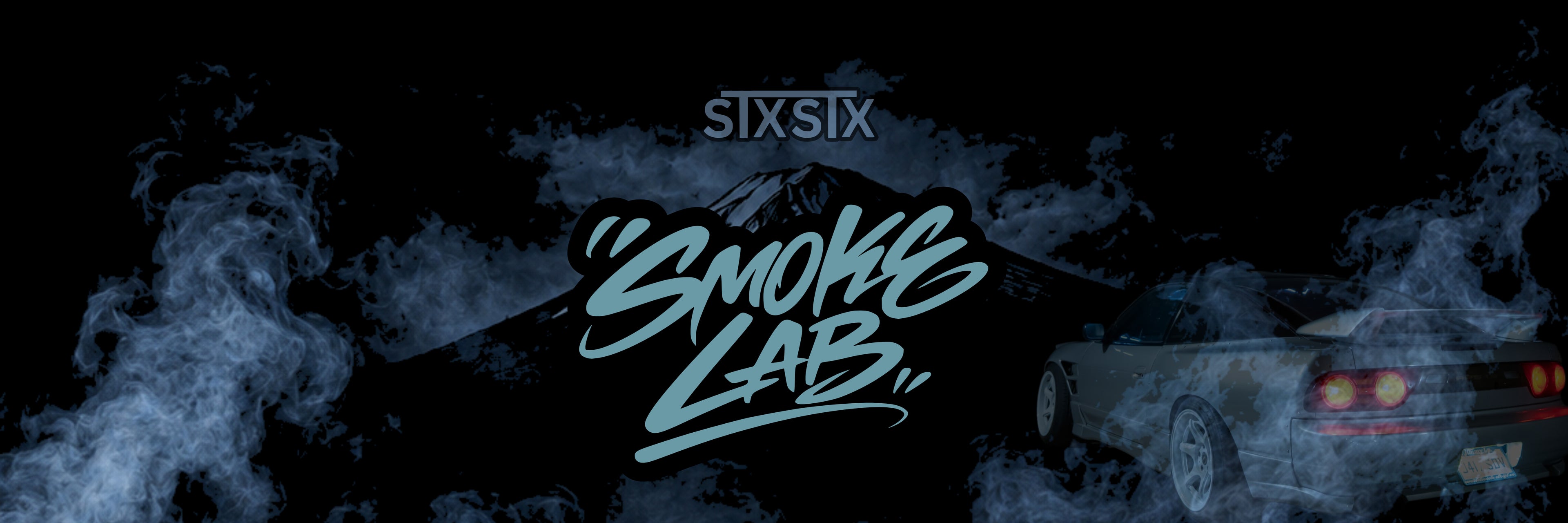 Car with 'Smoke Lab' branding in a dark, smoky environment - Banner