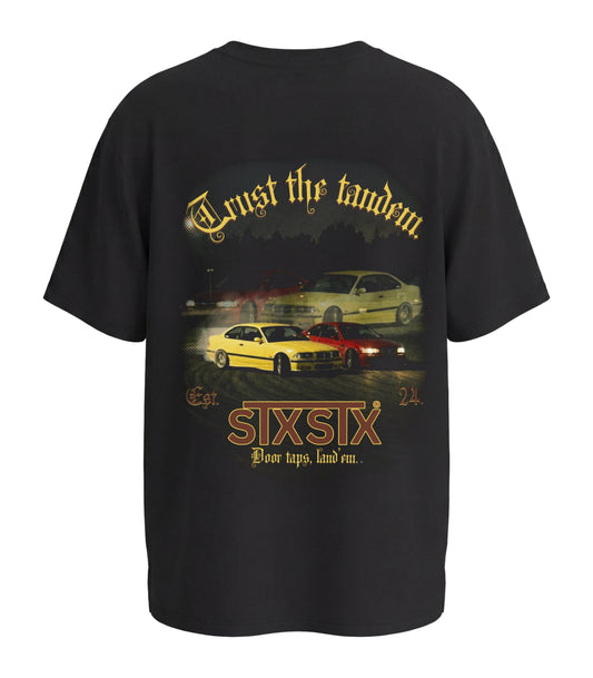 STXSTX premium Black Tshirt with a rear design of 2 bmws in tandem drift on a racetrack 3d mock up