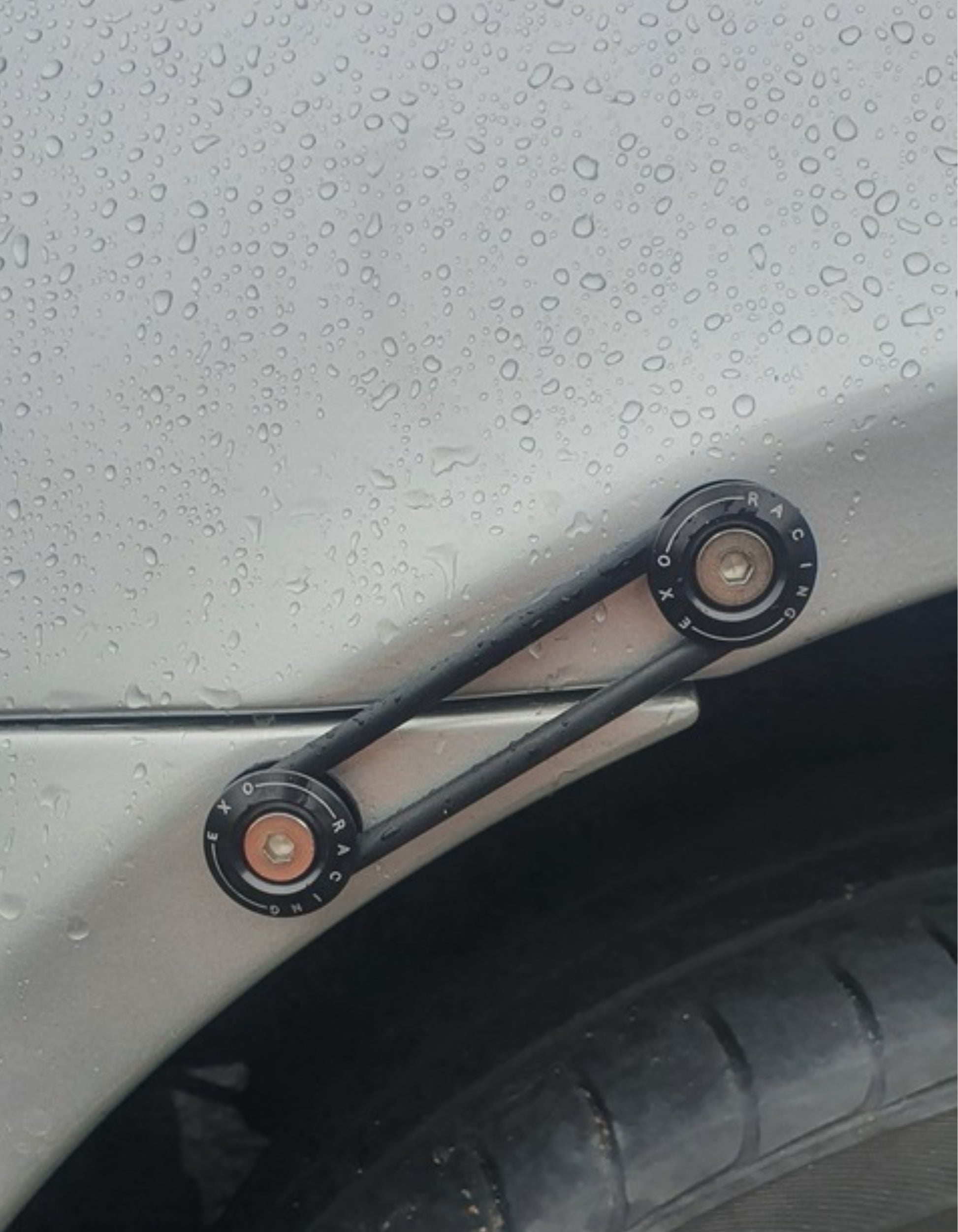 Set of black metal Bumper ties and black rubber rings on a grey mazda mx5 car
