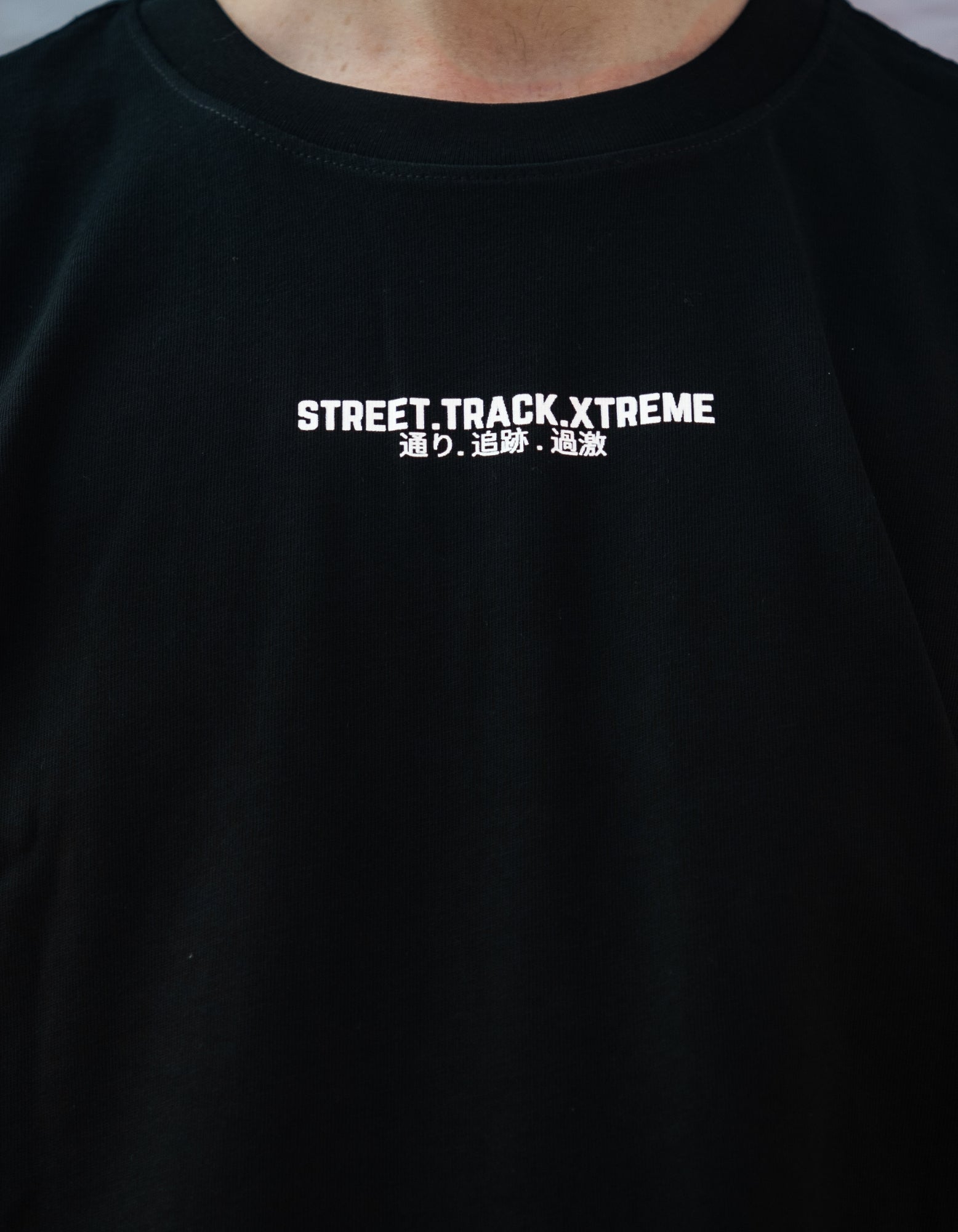Black t-shirt with 'STREET TRACK XTREME' text on a dark background