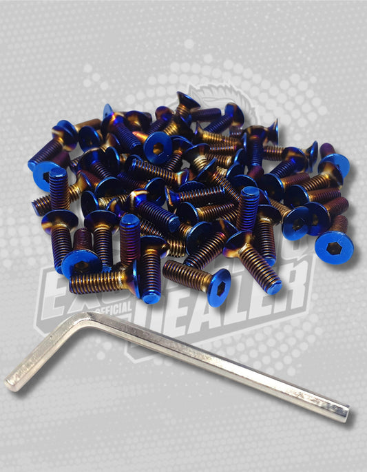 collection of titanium steering wheel bolts in a pile and next to it is a tool