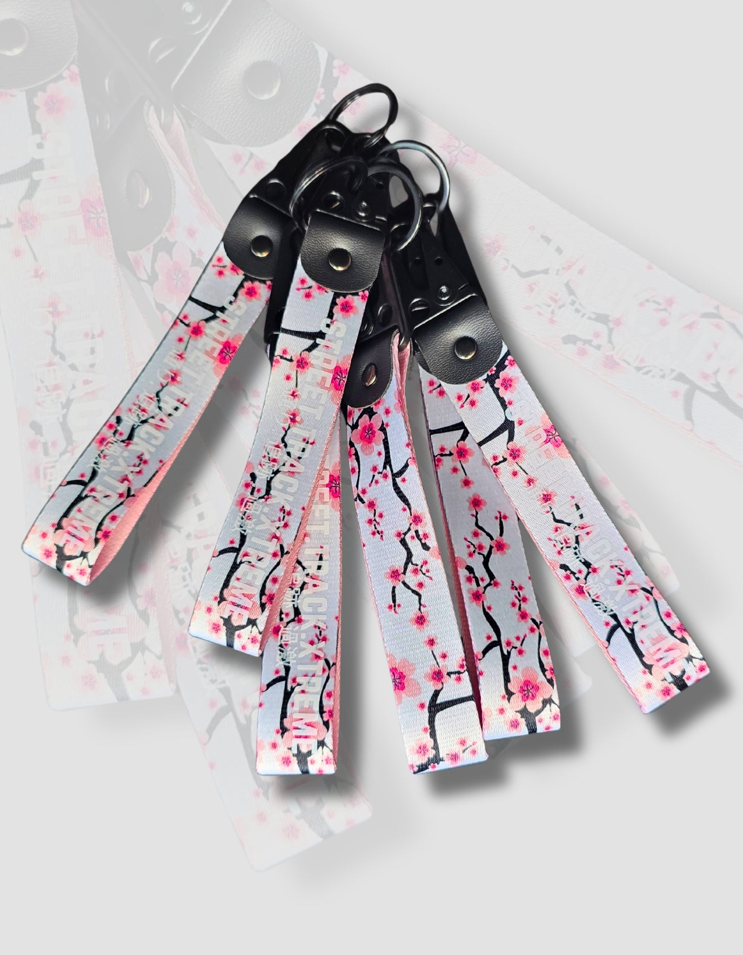 Cherry Blossom key-ring clip, JDM (Japanese domestic market) style with the words street track extreme printed on it. Japanese automotive style