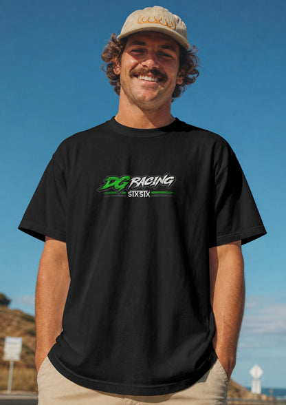 a man wearing a premium Black t-shirt with 'DG Racing and a stxstx' logo on a sky blue background