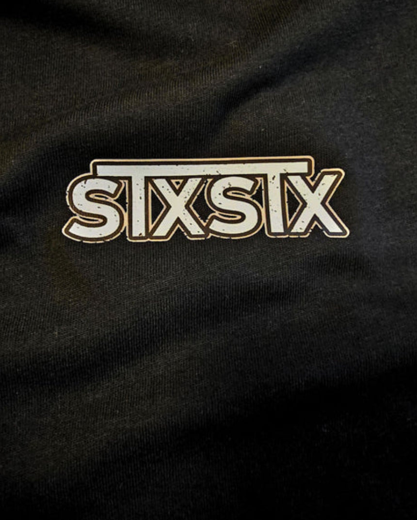 close up of premium stxstx logo on a premium black tshirt